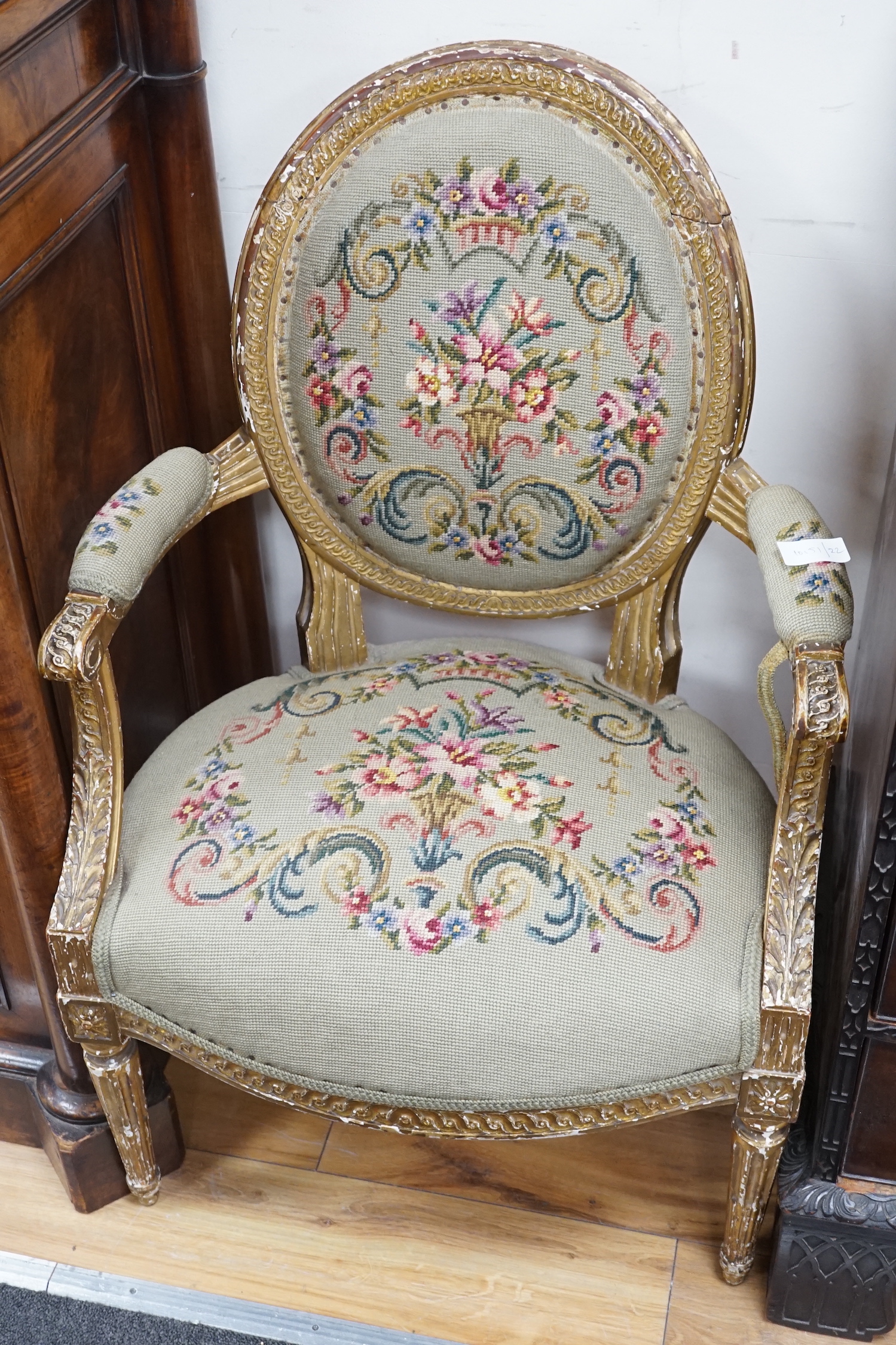 A 19th century French giltwood and composition fauteuil with tapestry upholstery, width 59cm, depth 46cm, height 90cm